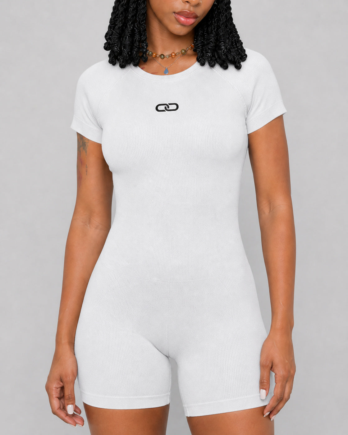 OOMEL CoreMotion Short-Sleeve Seamless Jumpsuit — Close-up fabric detail